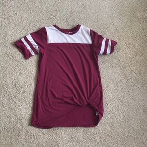 A youth shirt with a knot on the front